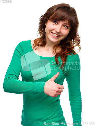 Image of Woman is showing thumb up gesture