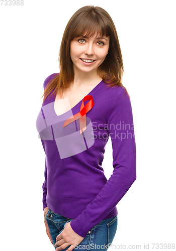 Image of Woman with the red awareness ribbon