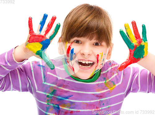 Image of Portrait of a cute girl playing with paints