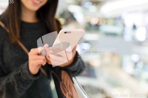 Image of Woman working on mobile phone