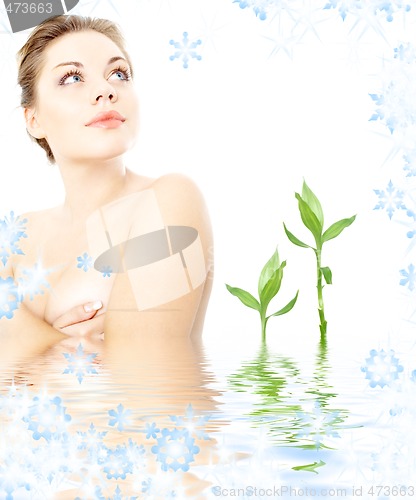 Image of clean lady in water with green plants