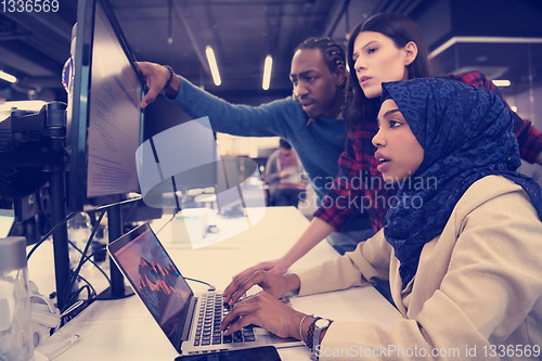 Image of multiethnics team of software developers working together