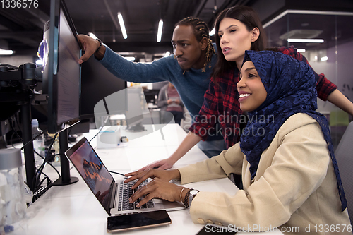 Image of multiethnics team of software developers working together