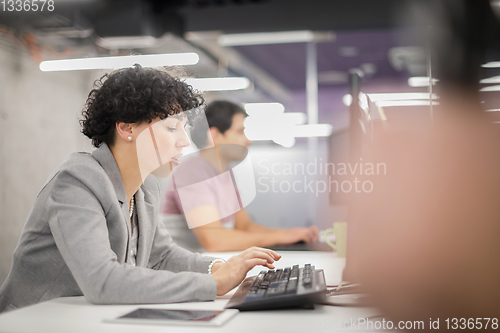 Image of female software developer using desktop computer