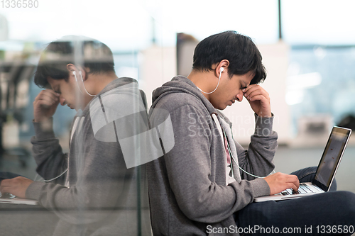 Image of software developer working on the floor