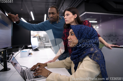 Image of multiethnics team of software developers working together