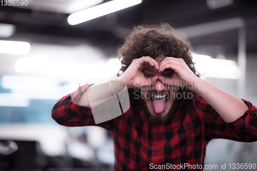 Image of Portrait of smiling male software developer