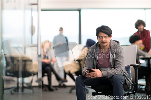 Image of software developer using mobile phone