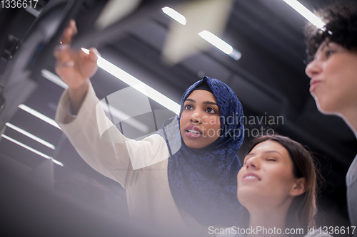 Image of multiethnics team of software developers working together