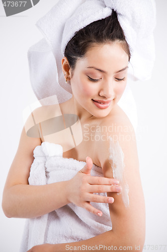 Image of Beautiful asian spa woman and lotion