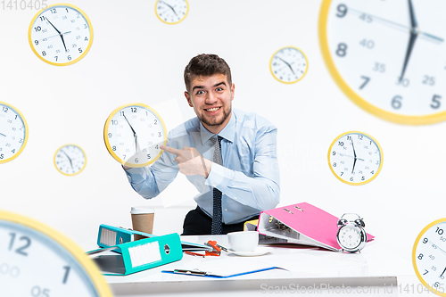 Image of Young man can\'t wait to go home from the nasty office