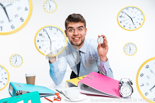 Image of Young man can\'t wait to go home from the nasty office