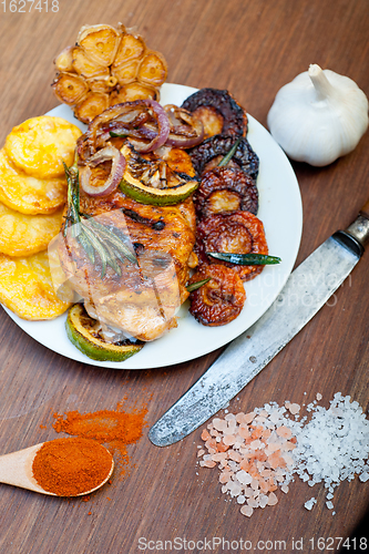 Image of roasted grilled BBQ chicken breast with herbs and spices 