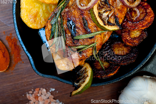 Image of roasted grilled BBQ chicken breast with herbs and spices 