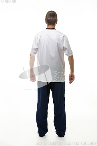 Image of Man showing doctor\'s clothes, back view, isolated on white background