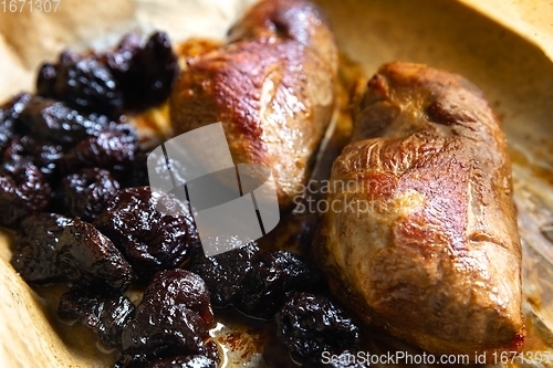 Image of Roast duck breast with plums prepared closeup