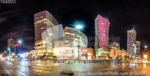 Image of Night skyline of Warsaw with soviet era and modern skyscrapers. 