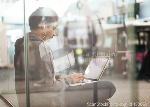 Image of software developer working on the floor