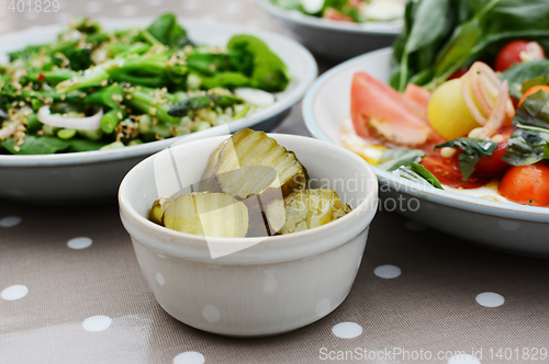 Image of Tangy gherkin slices and fresh summer salads