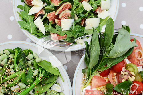 Image of Delicious fresh salads on a table