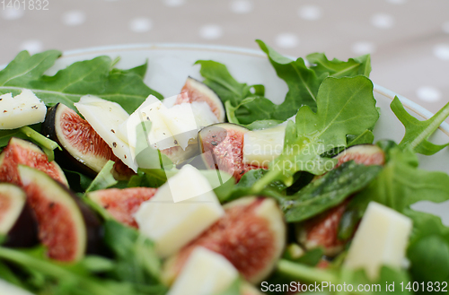 Image of Fresh fig salad with pecorino and rocket leaves