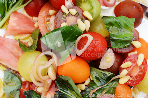 Image of Detail of colourful fresh tomato salad 