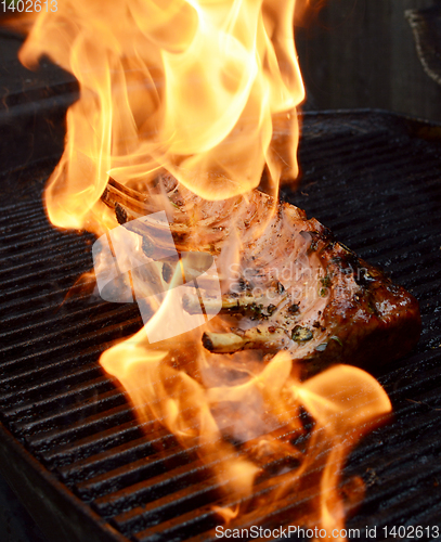 Image of Hot flames engulf grilled rack of lamb 