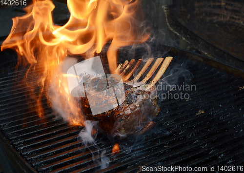 Image of Tender rack of lamb being grilled on a barbecue