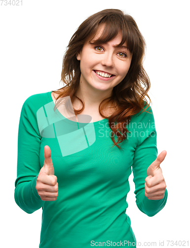 Image of Woman is showing thumb up gesture