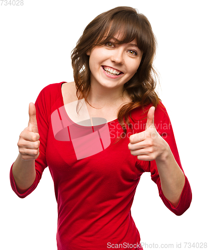 Image of Woman is showing thumb up gesture