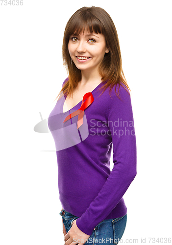 Image of Woman with the red awareness ribbon
