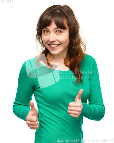 Image of Woman is showing thumb up gesture