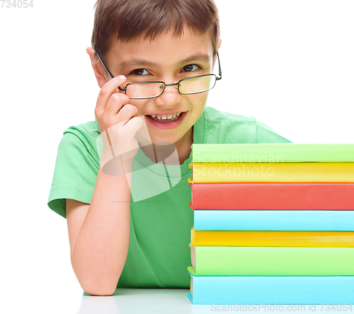 Image of Little boy is reading a book