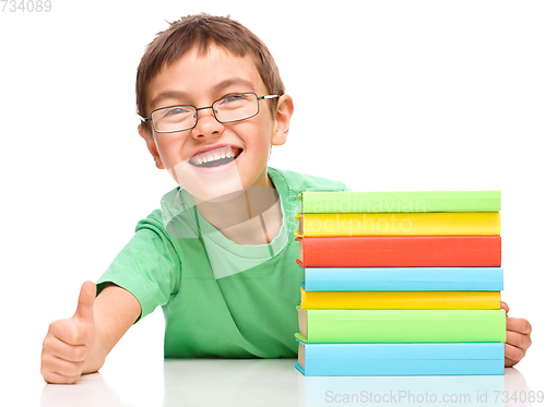 Image of Little boy is reading a book
