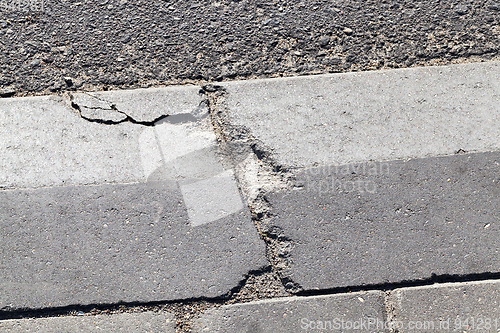 Image of broken concrete curb