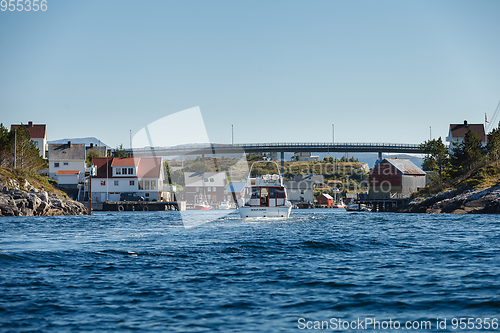 Image of view on norwegian fjord with houses along coastline