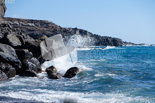 Image of beautiful wild beach with black sand