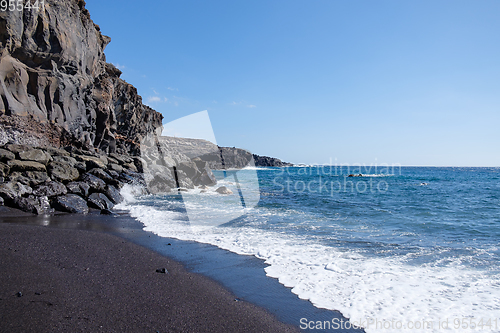 Image of beautiful wild beach with black sand