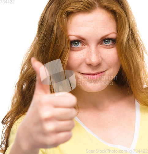 Image of Woman is showing thumb up gesture