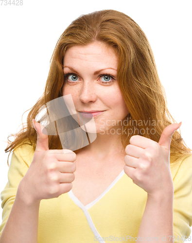 Image of Woman is showing thumb up gesture