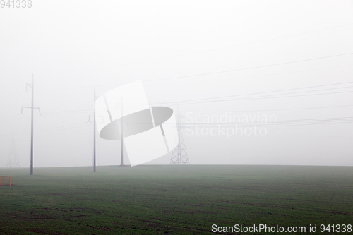 Image of electric poles in the mist