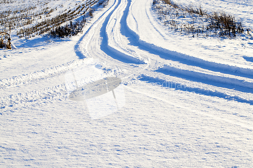 Image of traces of the wheels of the car close-up