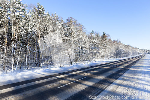 Image of photo of a diagonal asphalt road