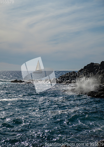 Image of sail boat at horizon line