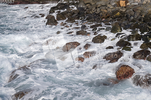 Image of beautiful wild beach with black sand