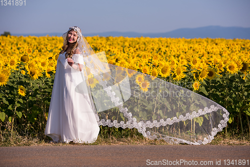 Image of asian woman at sunflower field