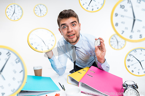 Image of Young man can\'t wait to go home from the nasty office