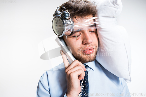 Image of Young man getting a lot of work and deadline, insomnia