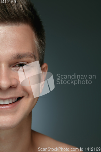 Image of Close-up portrait of young man isolated on grey studio background