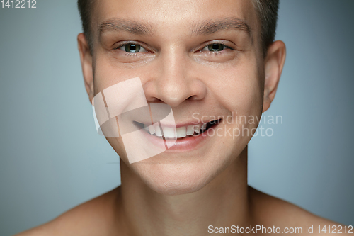 Image of Portrait of shirtless young man isolated on grey studio background